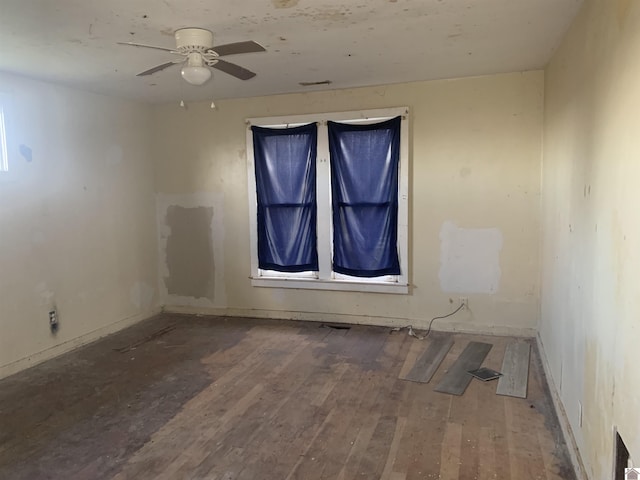 unfurnished room with ceiling fan and wood-type flooring