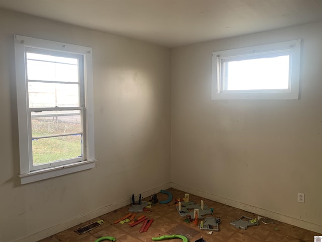 spare room featuring a wealth of natural light