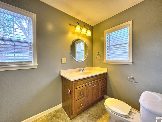 bathroom with tile patterned floors, vanity, and toilet