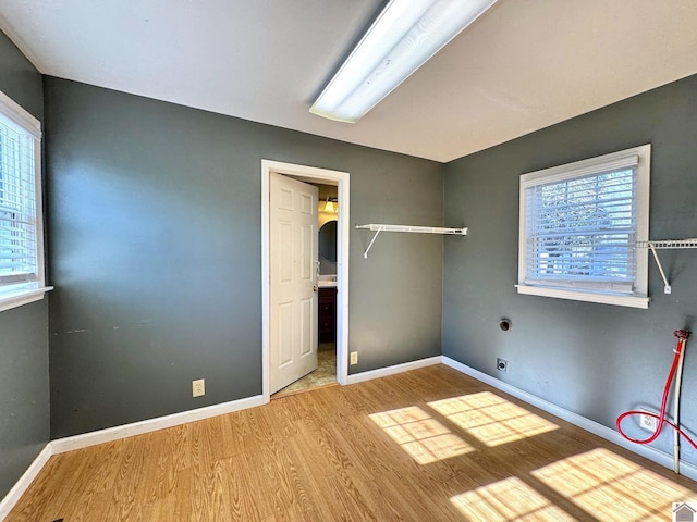 unfurnished bedroom with hardwood / wood-style flooring