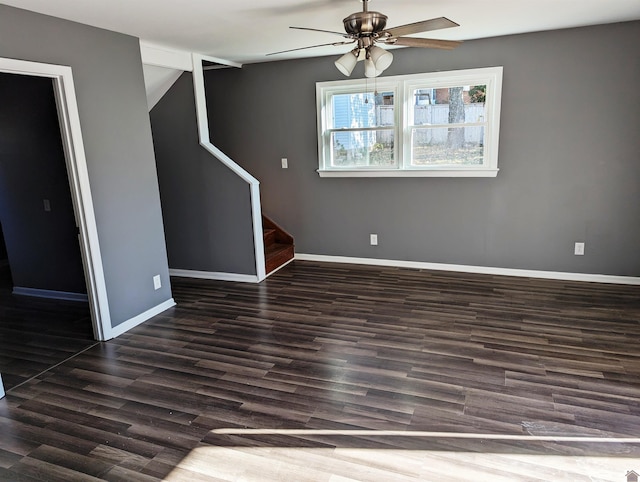 unfurnished room with dark hardwood / wood-style floors and ceiling fan