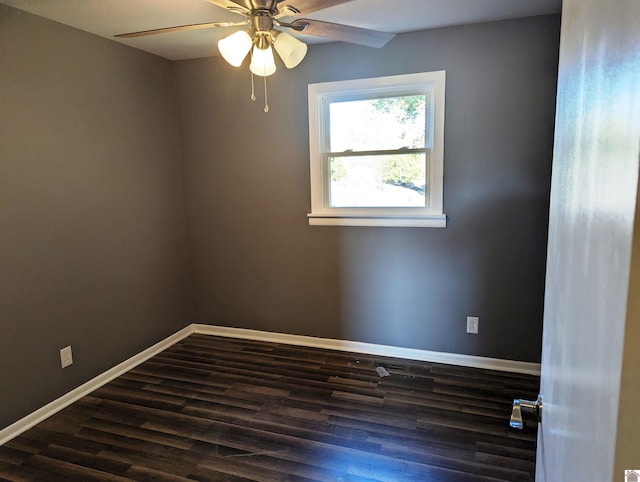 spare room featuring ceiling fan and dark hardwood / wood-style floors