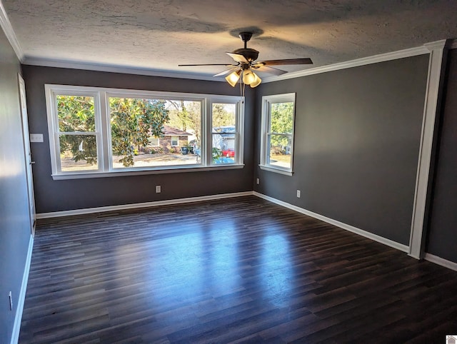 unfurnished room with ornamental molding, ceiling fan, and dark wood-type flooring