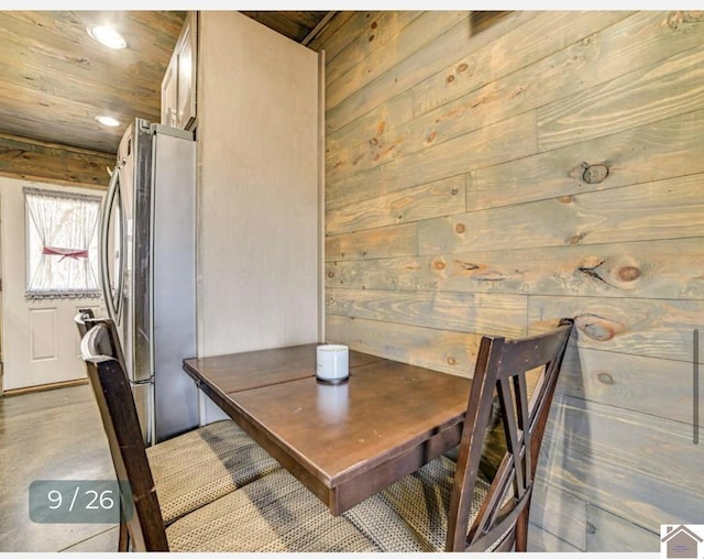 unfurnished dining area with wooden walls