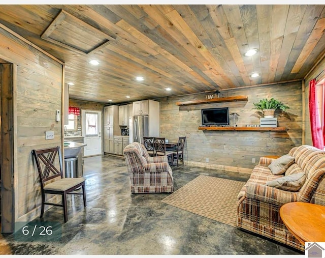 living room with wood walls and wood ceiling