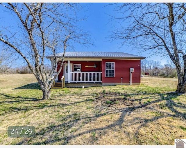 ranch-style house featuring a porch and a front yard