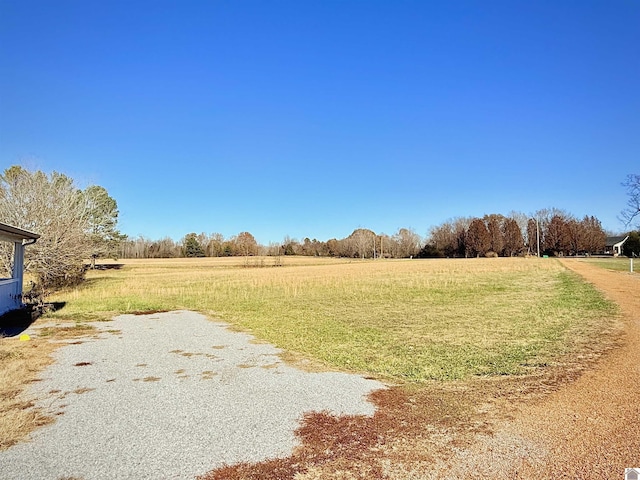 view of yard with a rural view