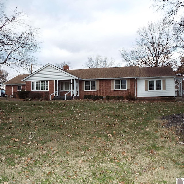 single story home featuring a front yard