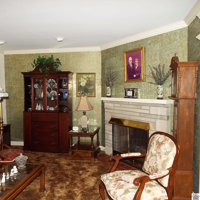 sitting room featuring a stone fireplace and crown molding