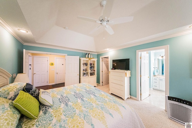 bedroom with ceiling fan, ensuite bathroom, light colored carpet, and ornamental molding