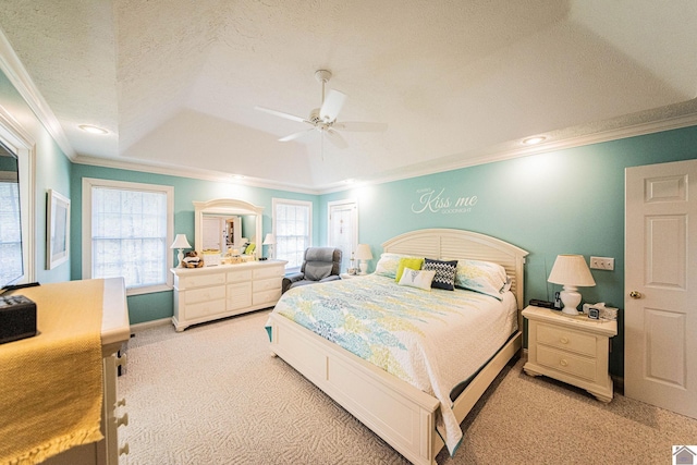 carpeted bedroom featuring ceiling fan, a textured ceiling, and ornamental molding