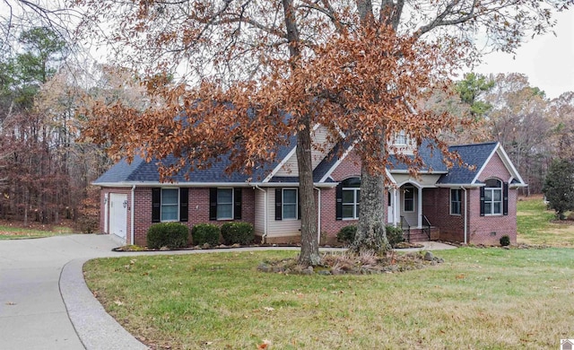 view of front of property with a garage and a front lawn