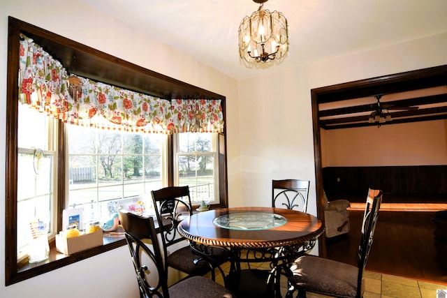 dining room featuring tile patterned floors and a notable chandelier