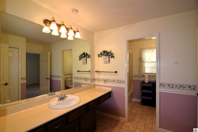 bathroom featuring tile patterned floors, a shower with curtain, vanity, and toilet