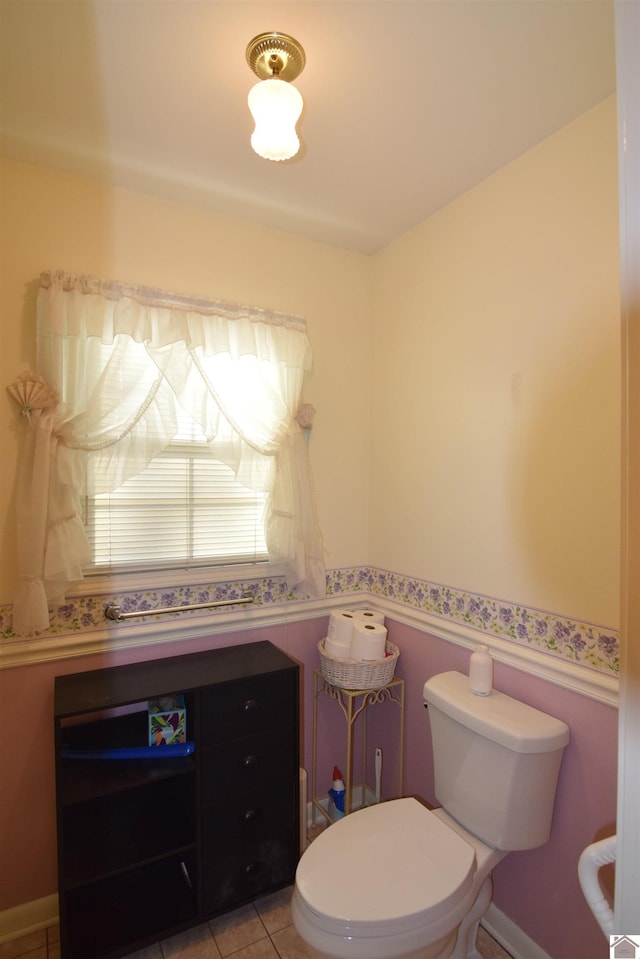 bathroom with tile patterned flooring and toilet