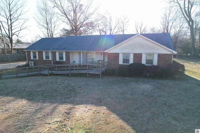 ranch-style house featuring a front lawn