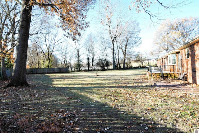 view of yard with a wooden deck