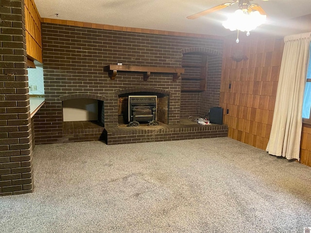 3480 Radio Rd, Almo, KY 42020 - unfurnished living room with ceiling fan, carpet, a textured ceiling, and a brick fireplace