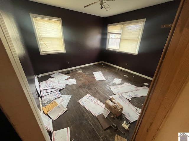 empty room featuring ceiling fan and wood-type flooring