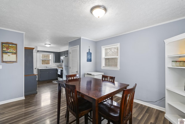 dining room with a textured ceiling, ornamental molding, and dark wood-type flooring