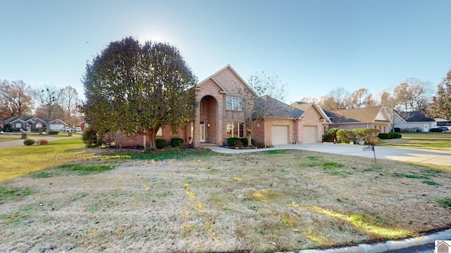 view of property with a front yard and a garage