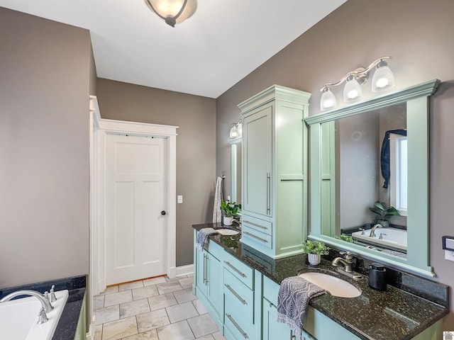 bathroom with a tub to relax in and vanity