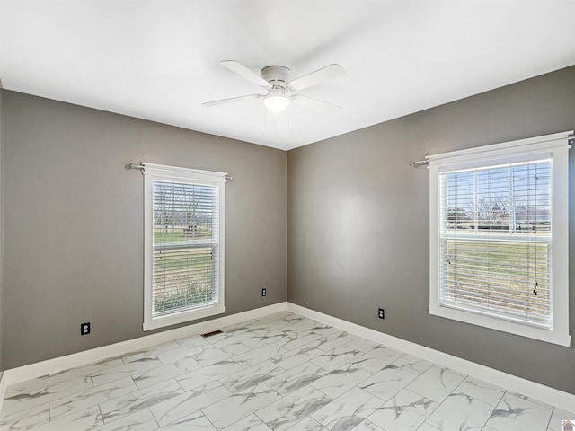 unfurnished room featuring ceiling fan