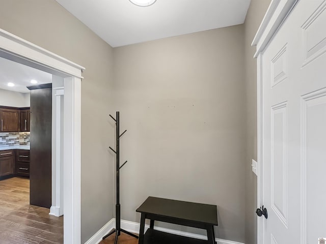 hallway with dark hardwood / wood-style floors