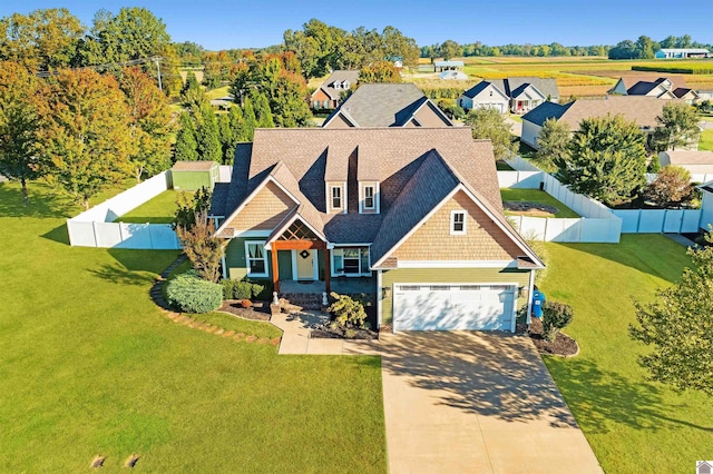 view of front facade featuring a garage and a front yard