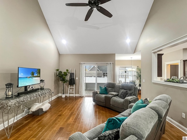 living room with ceiling fan, high vaulted ceiling, and hardwood / wood-style flooring