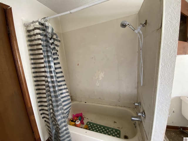 bathroom featuring shower / bath combination with curtain