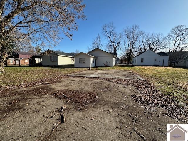 view of home's exterior with a yard