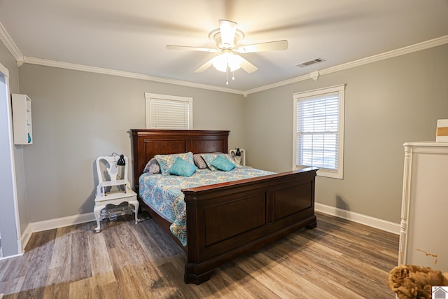 bedroom with hardwood / wood-style flooring, ceiling fan, and ornamental molding