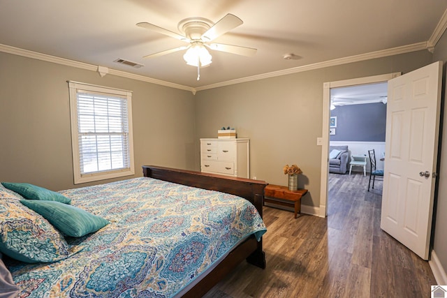 bedroom with ceiling fan, dark hardwood / wood-style flooring, and ornamental molding