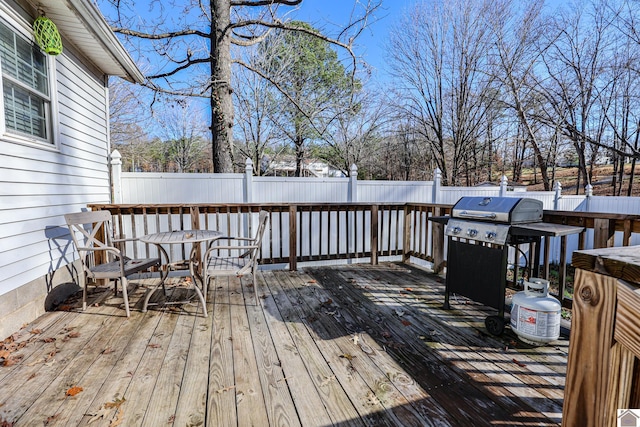 wooden terrace featuring grilling area