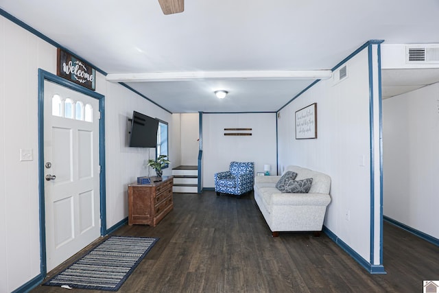 entrance foyer with dark hardwood / wood-style flooring and wood walls