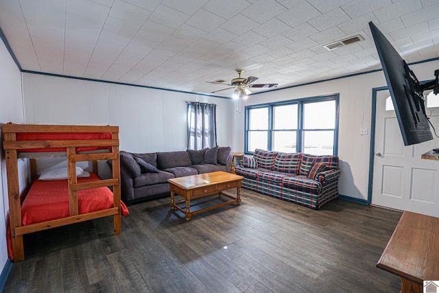 living room with ceiling fan, dark hardwood / wood-style flooring, and ornamental molding