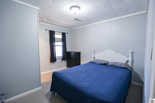 carpeted bedroom with crown molding