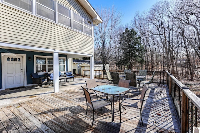 wooden terrace featuring an outdoor living space