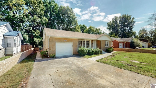 ranch-style house with a garage and a front lawn