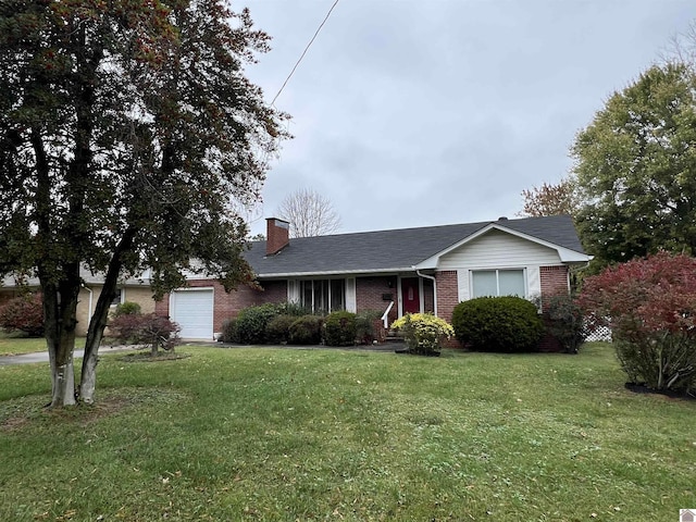 single story home featuring a front yard and a garage