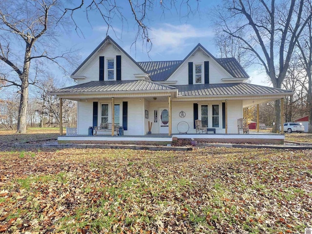 farmhouse inspired home with covered porch