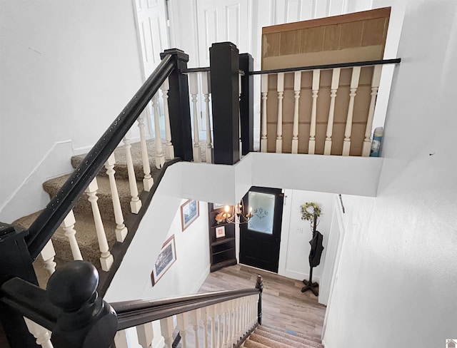 stairs featuring hardwood / wood-style flooring