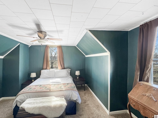 carpeted bedroom featuring vaulted ceiling and ceiling fan