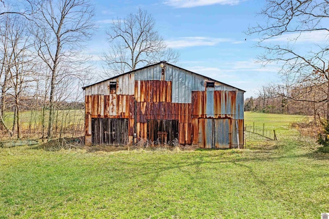 view of outbuilding with a lawn