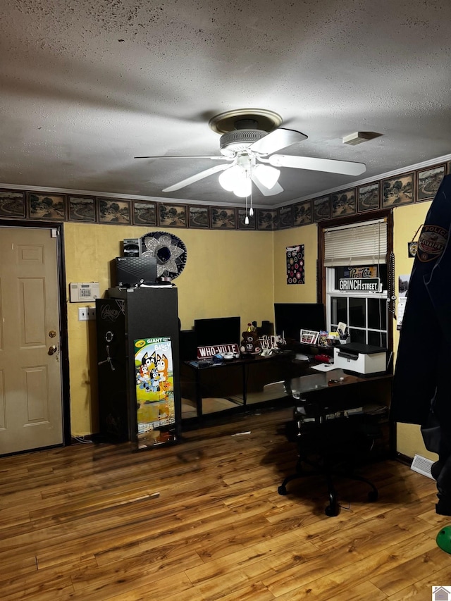 office with ceiling fan, a textured ceiling, and hardwood / wood-style flooring