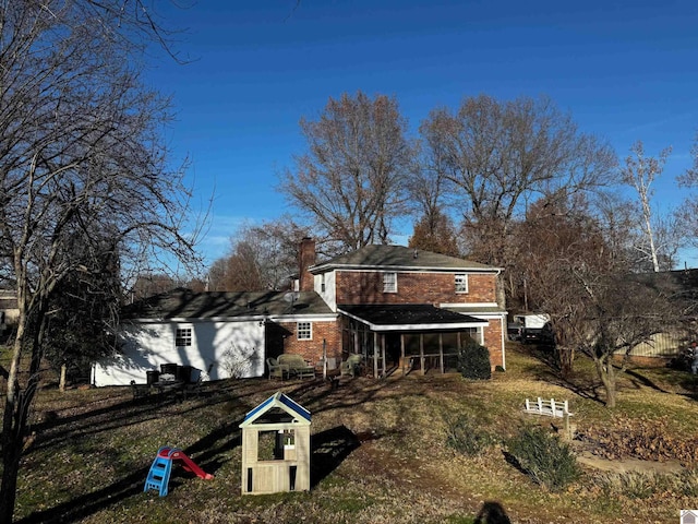 view of front of home with a sunroom