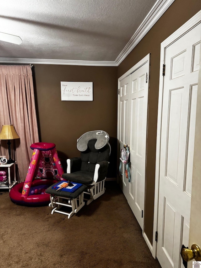 interior space featuring dark carpet, crown molding, and a textured ceiling