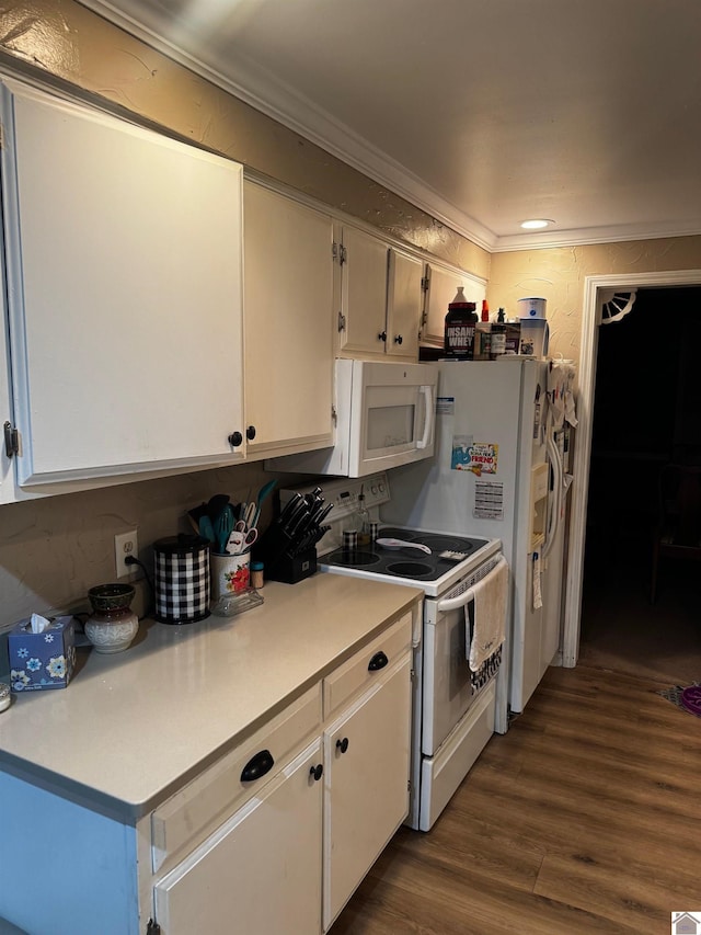 kitchen with white cabinets, crown molding, white appliances, and dark wood-type flooring