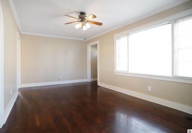 empty room featuring dark hardwood / wood-style flooring, plenty of natural light, crown molding, and ceiling fan